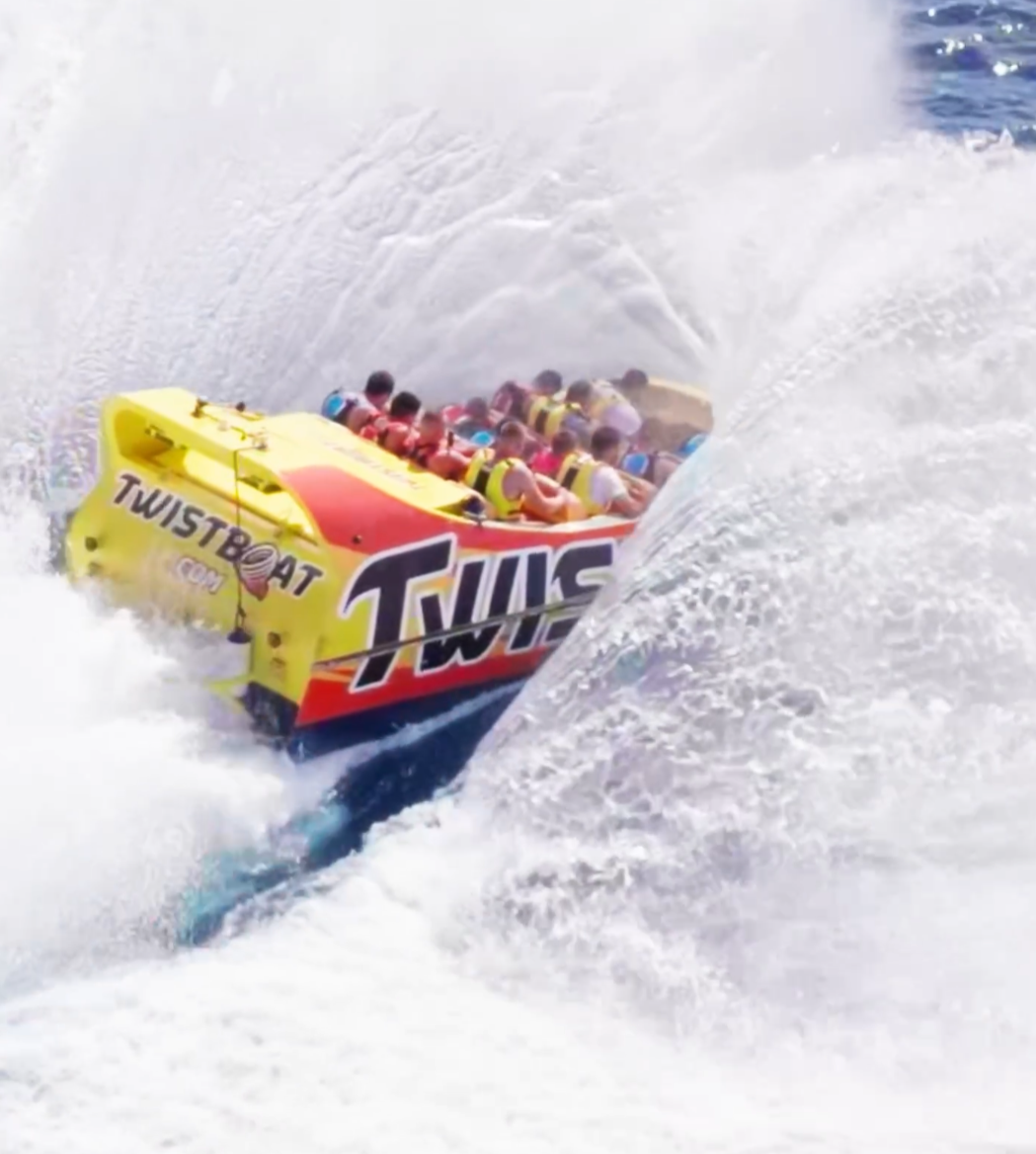 Twistboat splashing through waves