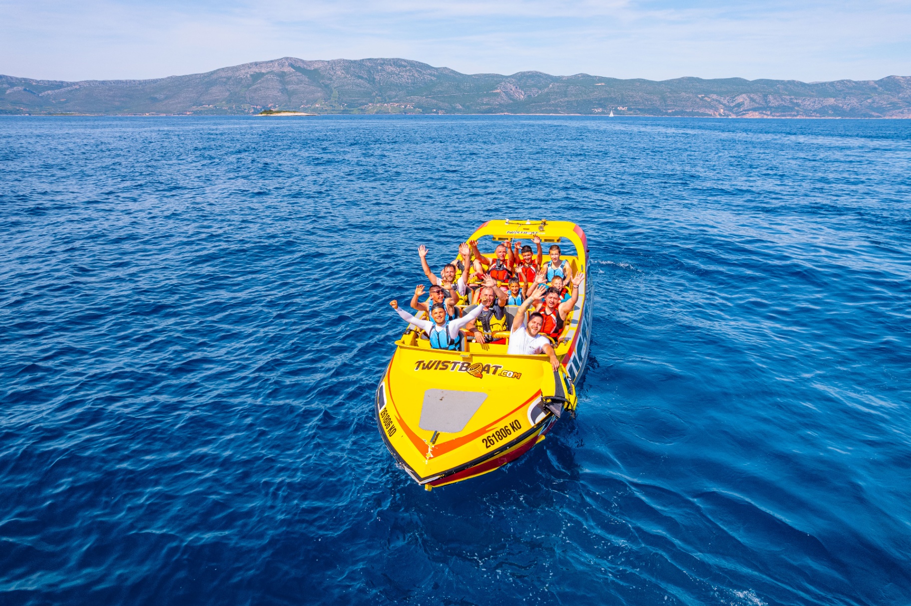 Happy guests waving from the Twistboat